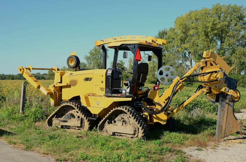 A stump grinder wheel cutting into a stump in a lawn, wood chips flying